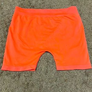 Orange stretch dance shorts one size, but they’d probably fit XS or SMALL EUC